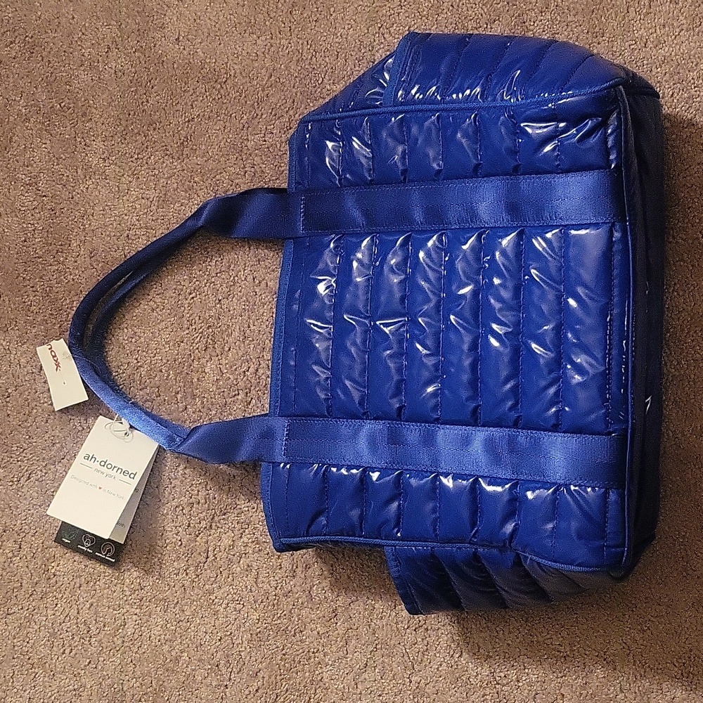 Ah-dorned blue purse